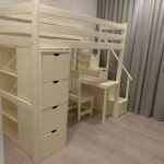 Loft bed with desk and shelves with staircase